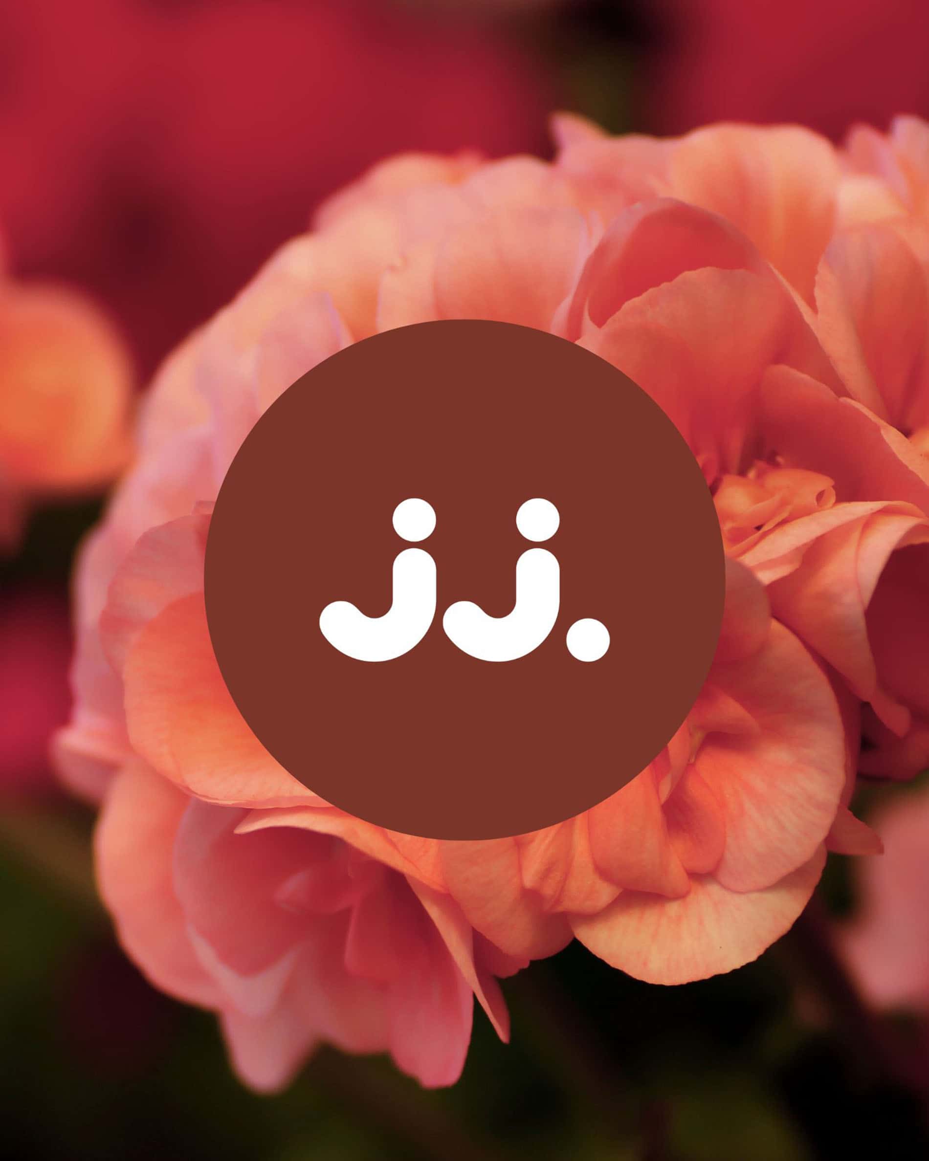 Fleurs de géranium rosées avec logo jj., pour la senteur Citronnelle & Géranium.